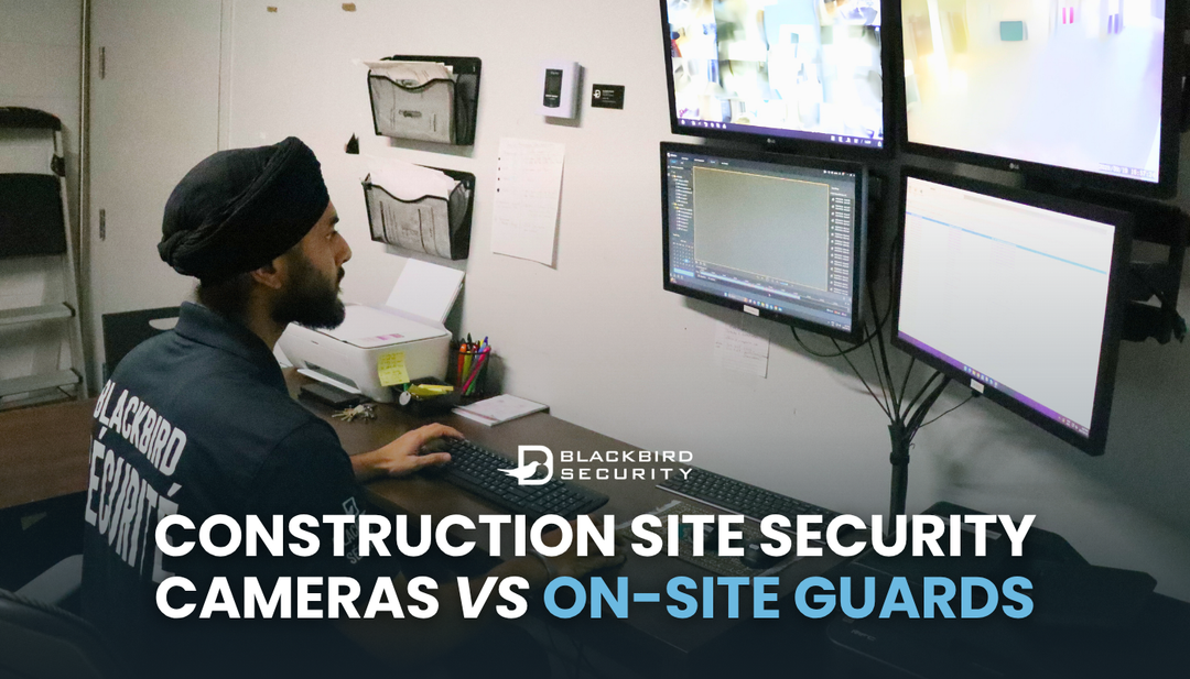 A Blackbird Security guard sits at a desk monitoring CCTV cameras