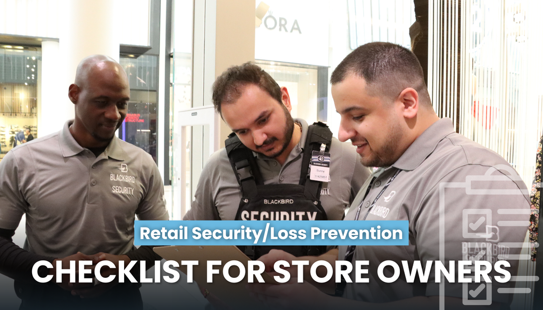 3 retail security guards examine a clipboard inside a store.