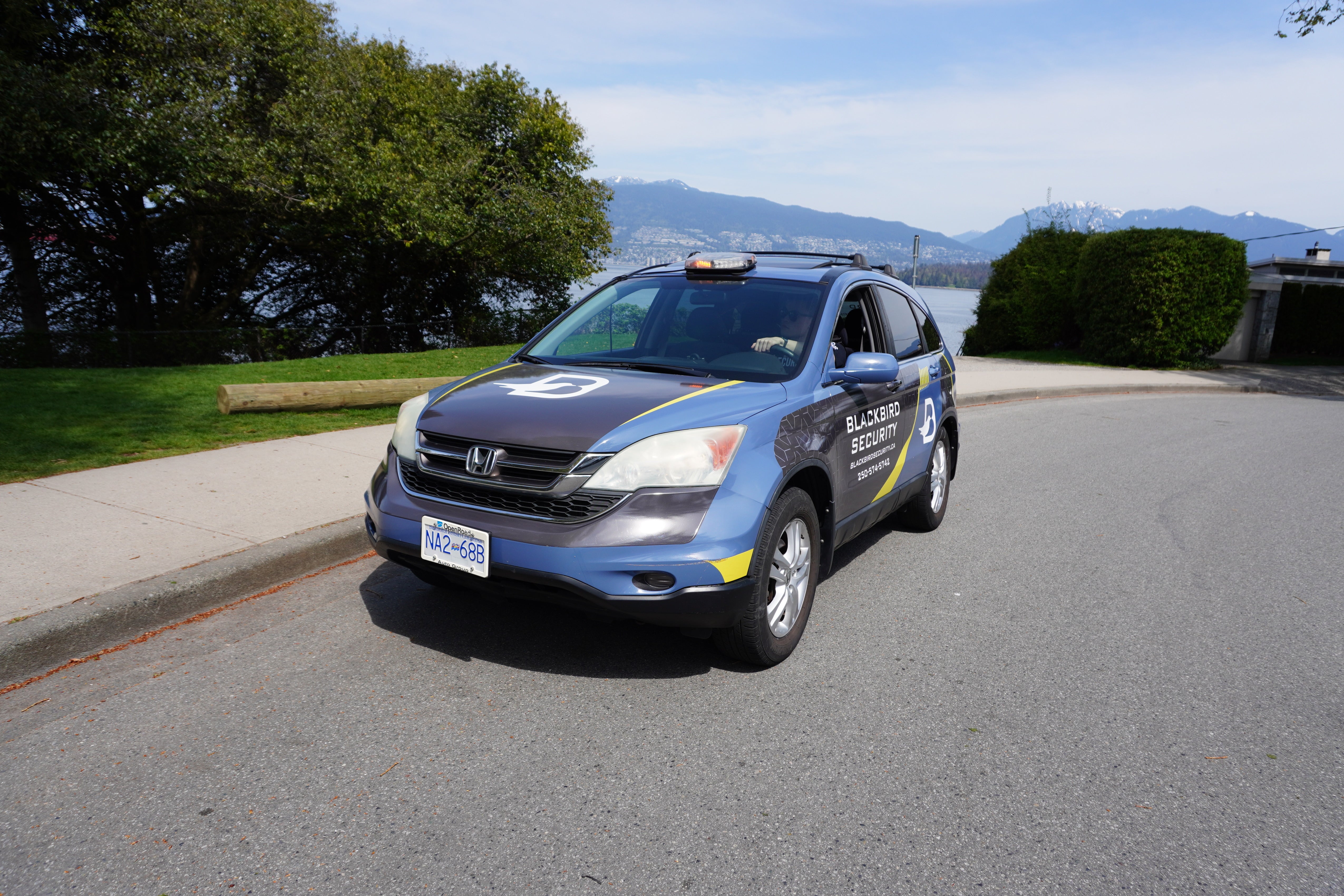 Blackbird security guard in Mobile patrol car