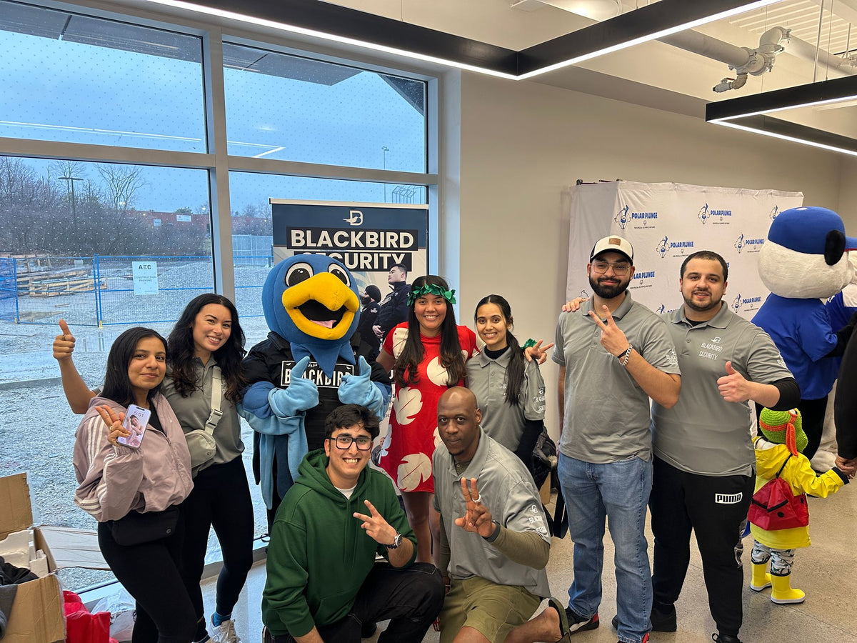 Blackbird Security staff posing at the annual polar plunge in Toronto, Ontario