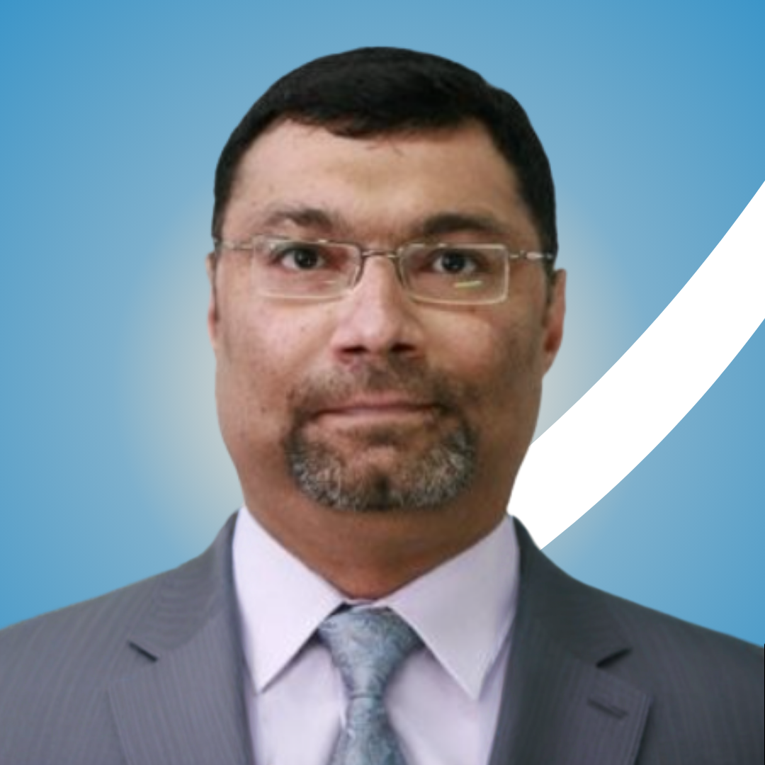 Man wearing glasses and a suit with a blue gradient background