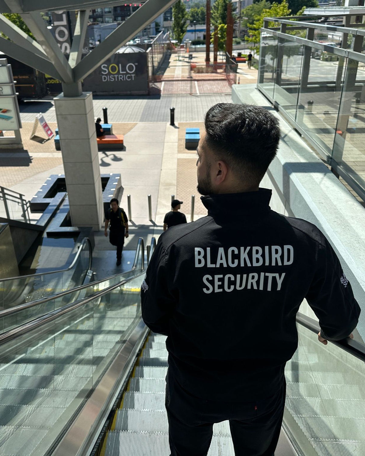 Blackbird Security Uniform Guard patrolling a mall/residential area