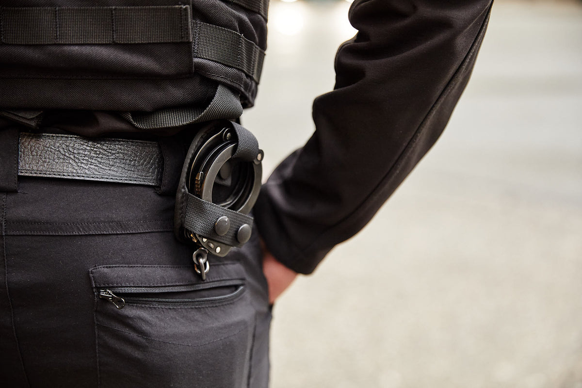 Handcuffs attached to a Blackbird Security professional's uniform