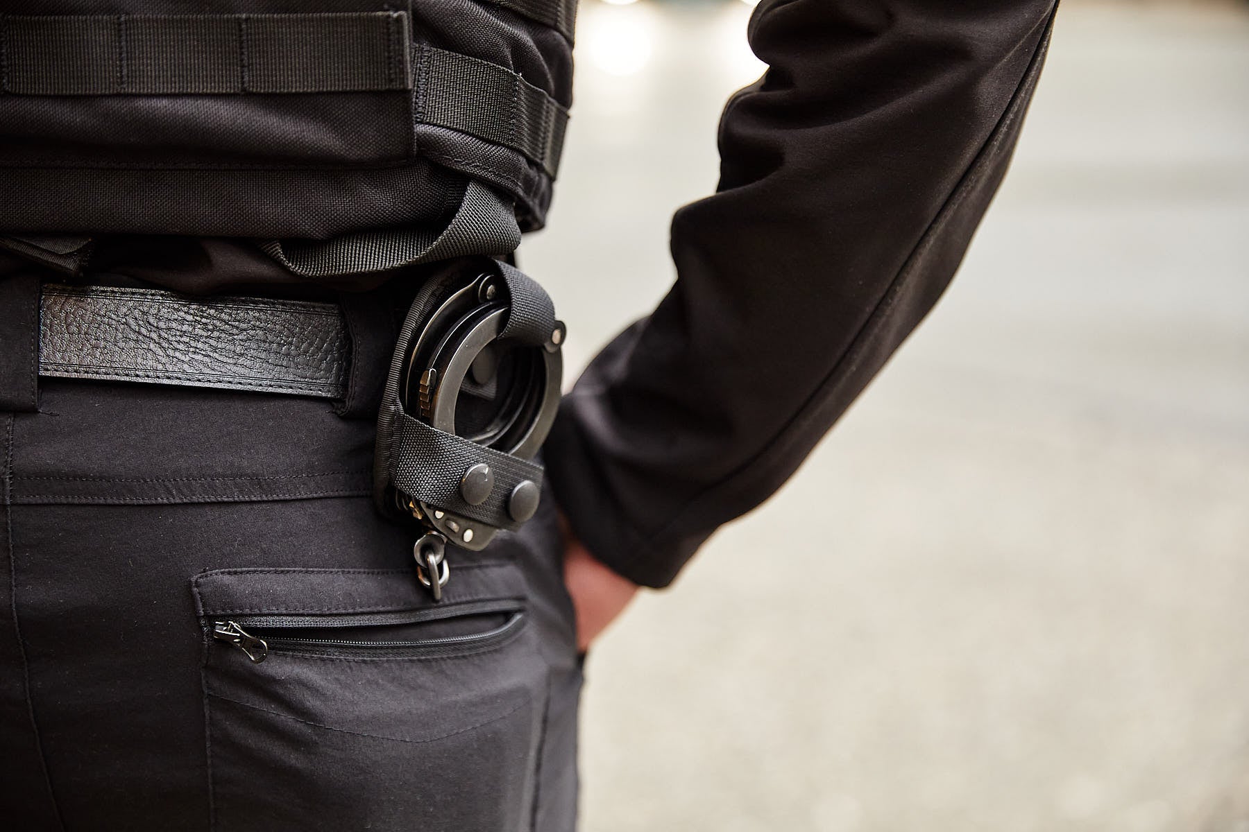 Handcuffs attached to a Blackbird Security professional's uniform