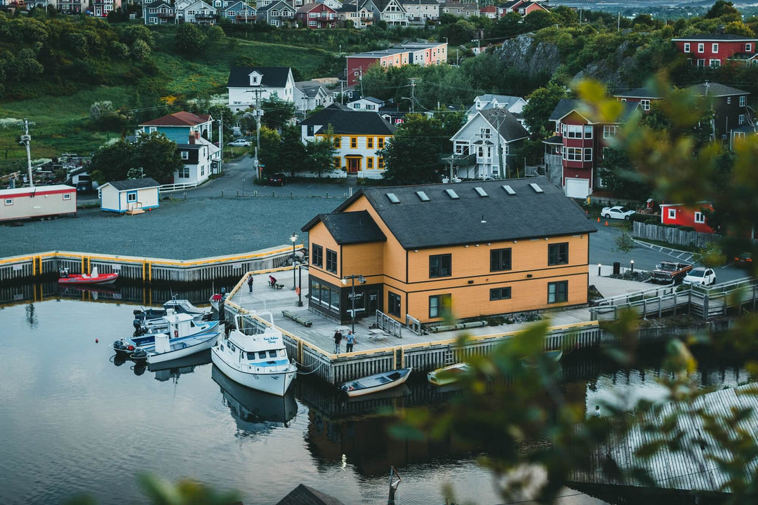 Marina and restaurant on the water with boats around it